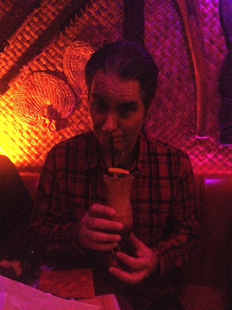 Andrew drinking a Hurricane at Hale Pele