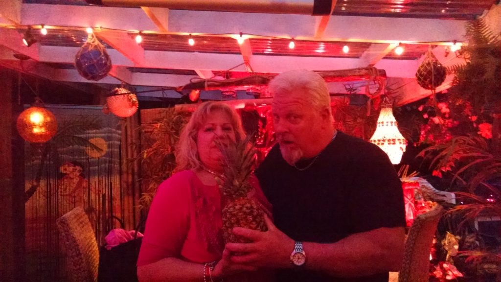 Bridget and John sharing a pineapple drink