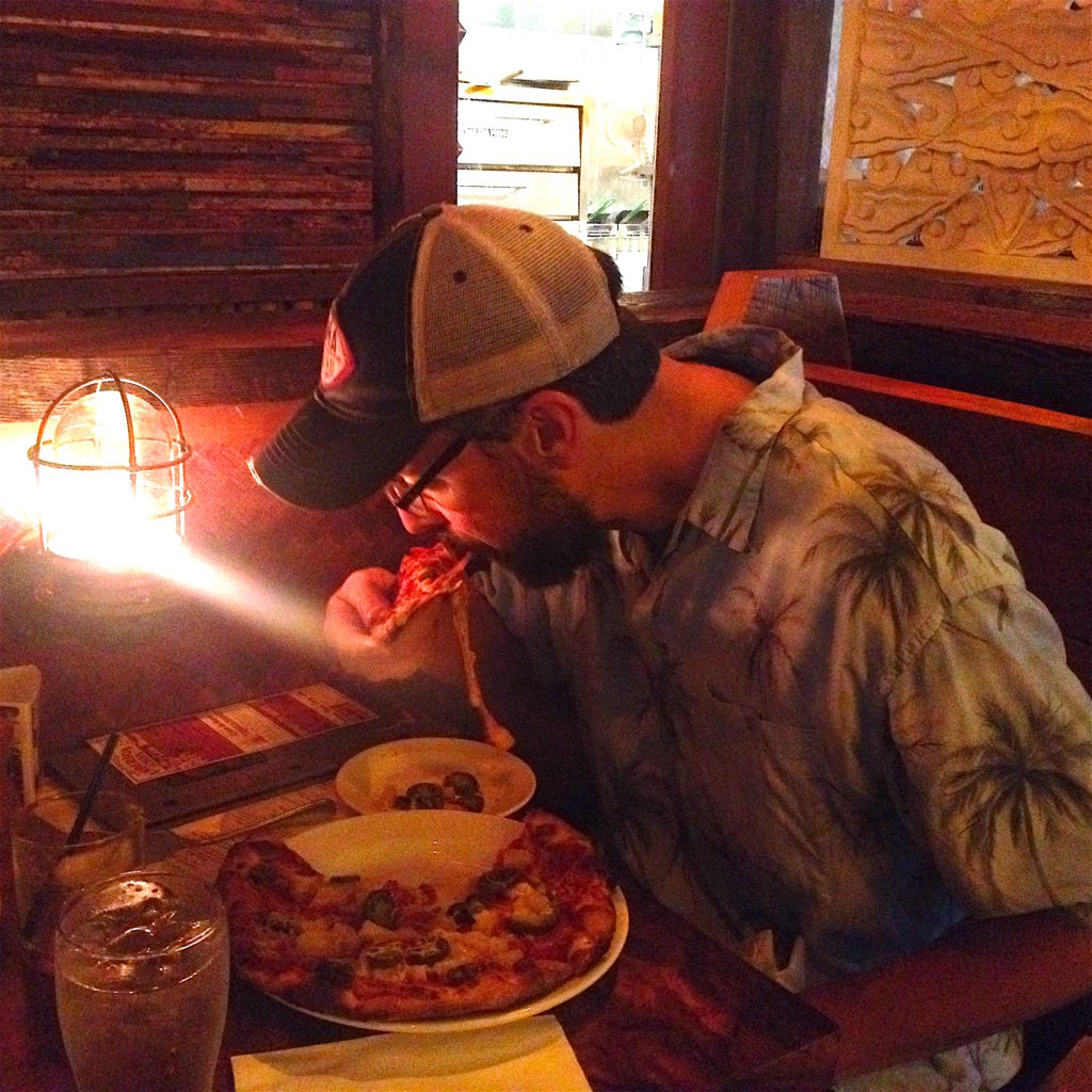 Rob eating pizza at North Shore Lagoon