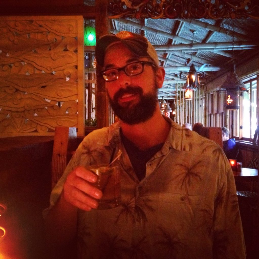 Rob drinking a Pineapple Rum Punch at North Shore Lagoon