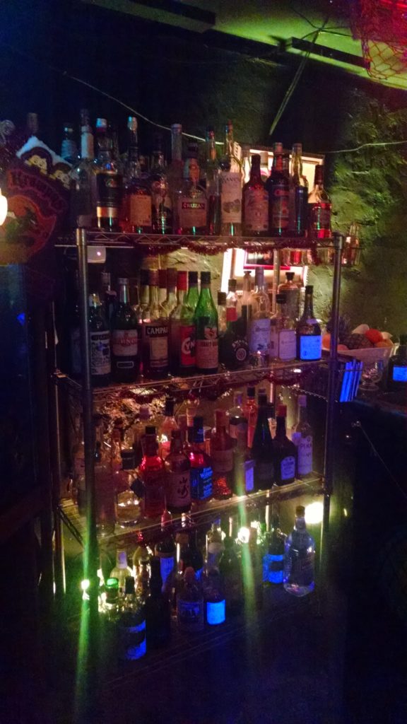 A large shelf of booze at The Monkey Hut