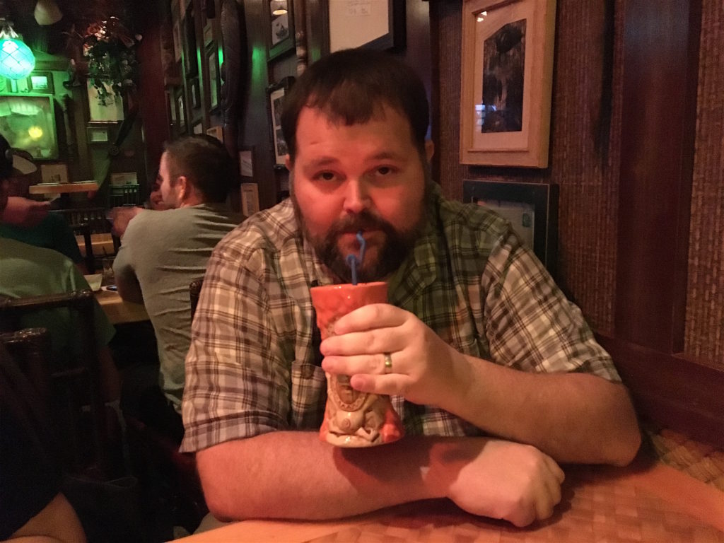 Joe drinking a Krakatoa Punch at Trader Sam's