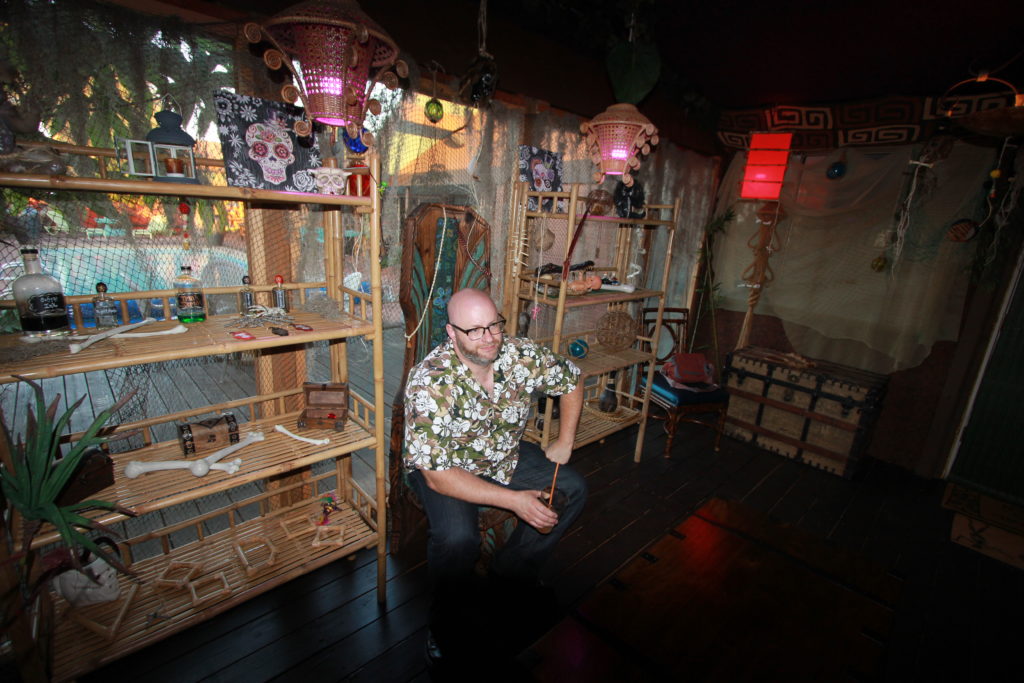 Ray sitting on the Witco Throne at Doctor Voodoo's Tiki Temple