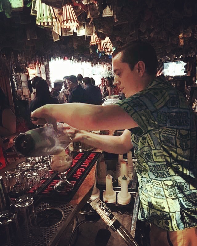 Brian Rechenmacher bartending at Forbidden Island