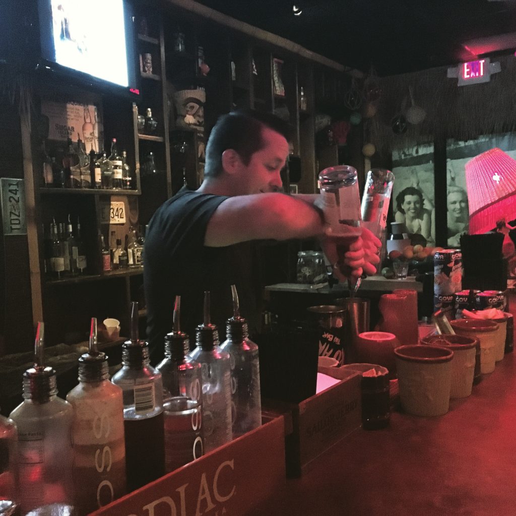 Joseph behind the bar at Aku Aku