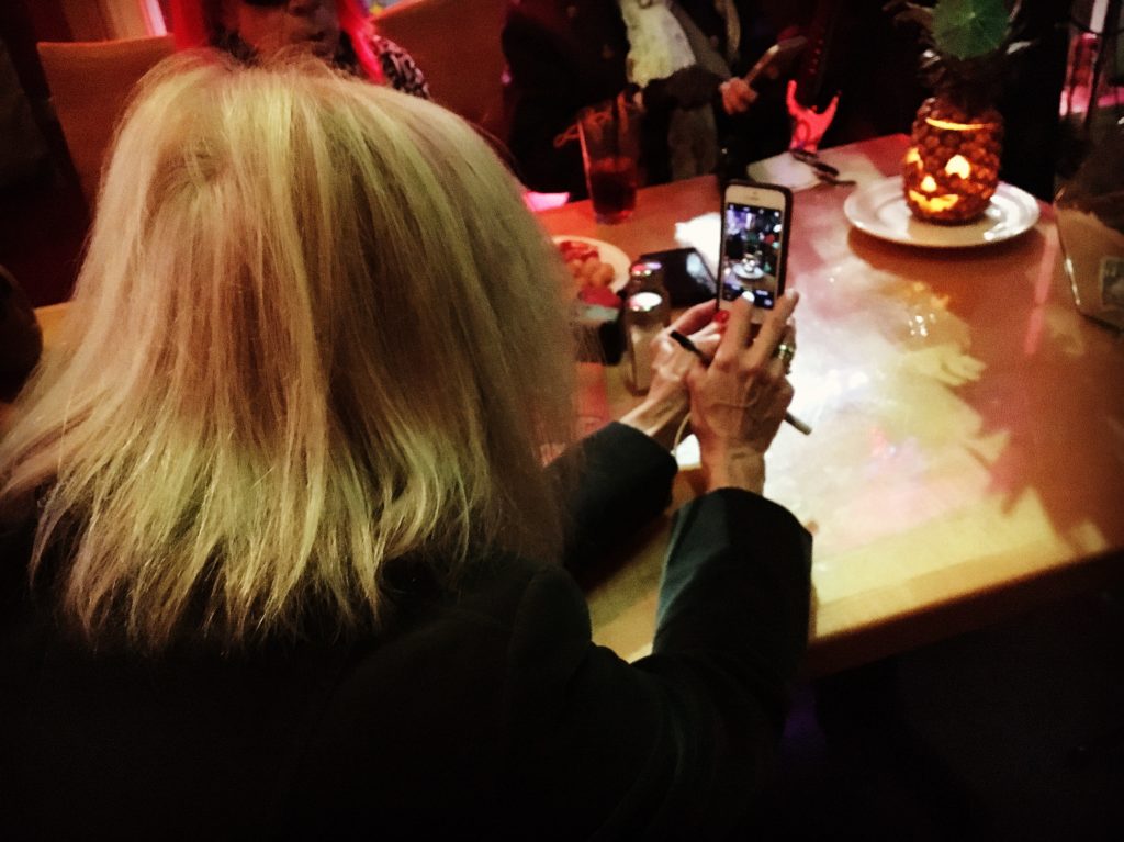 Taking a picture of Anita taking a picture of the pineapple jack-o-lantern