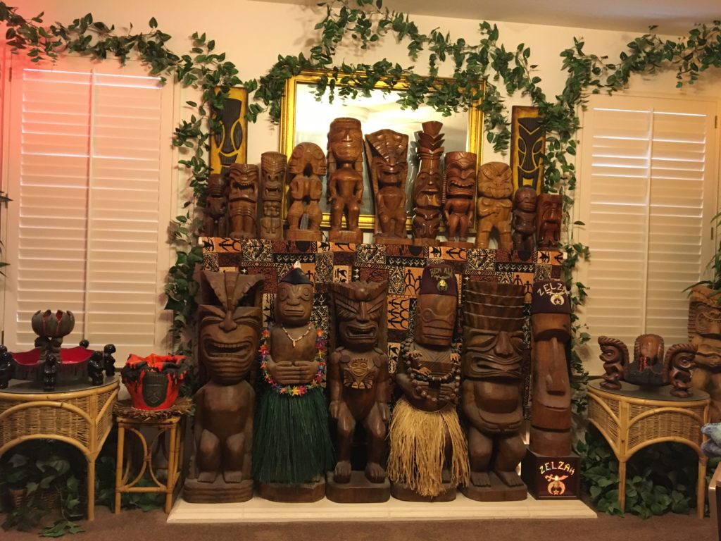 Tikis covering the fire place in the Family Room