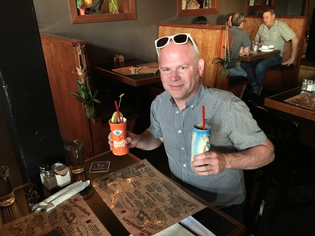 Dan double fisting tiki drinks at the Burgdian